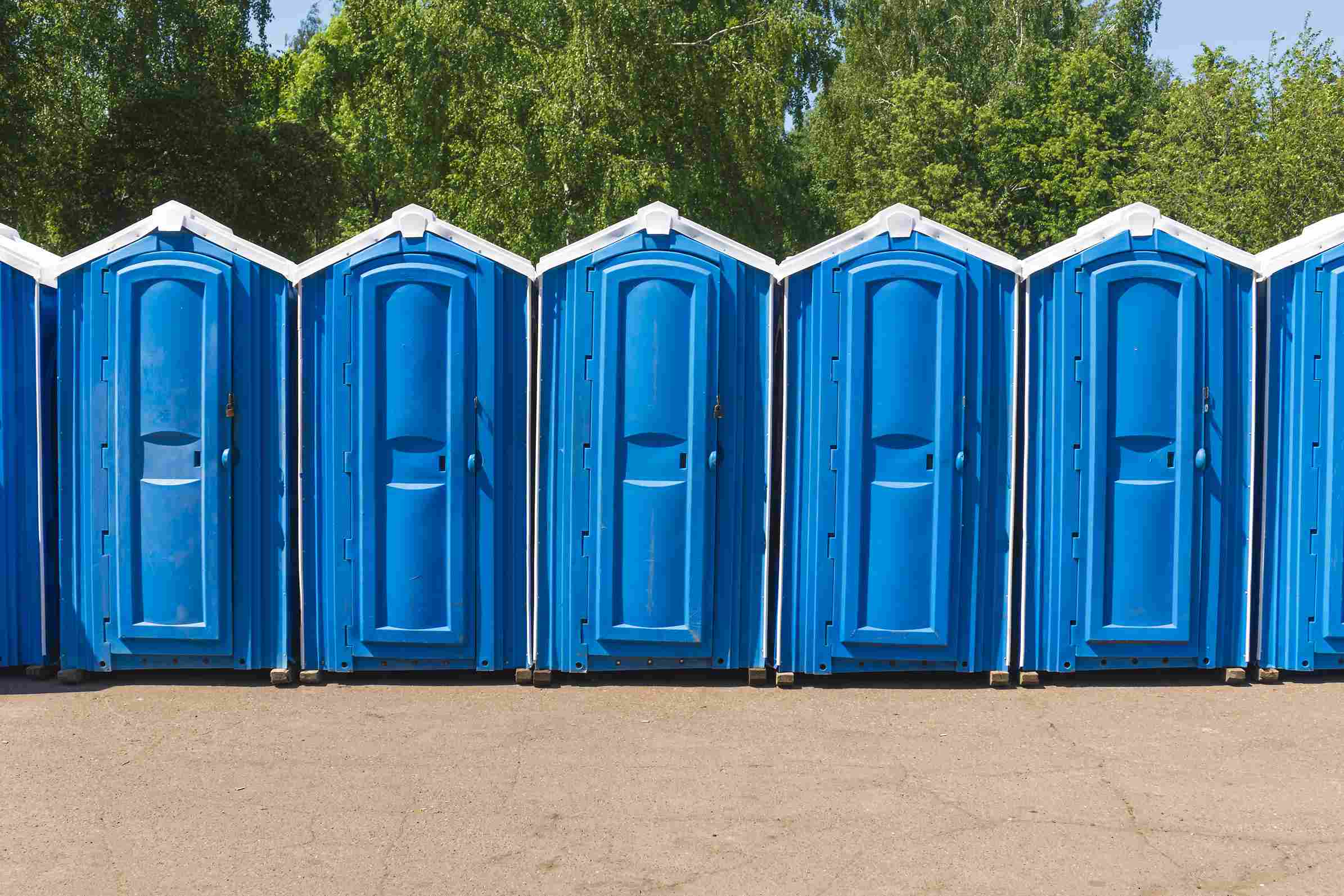 row-of-portable-chemical-toilets-of-various-colors-2024-10-21-09-02-52-utc